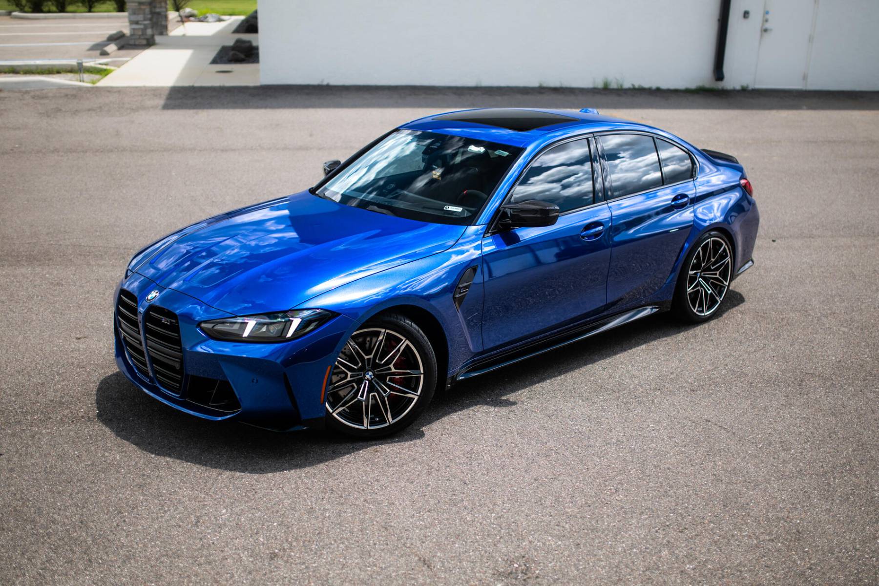 Blue BMW M3 with tinted windows